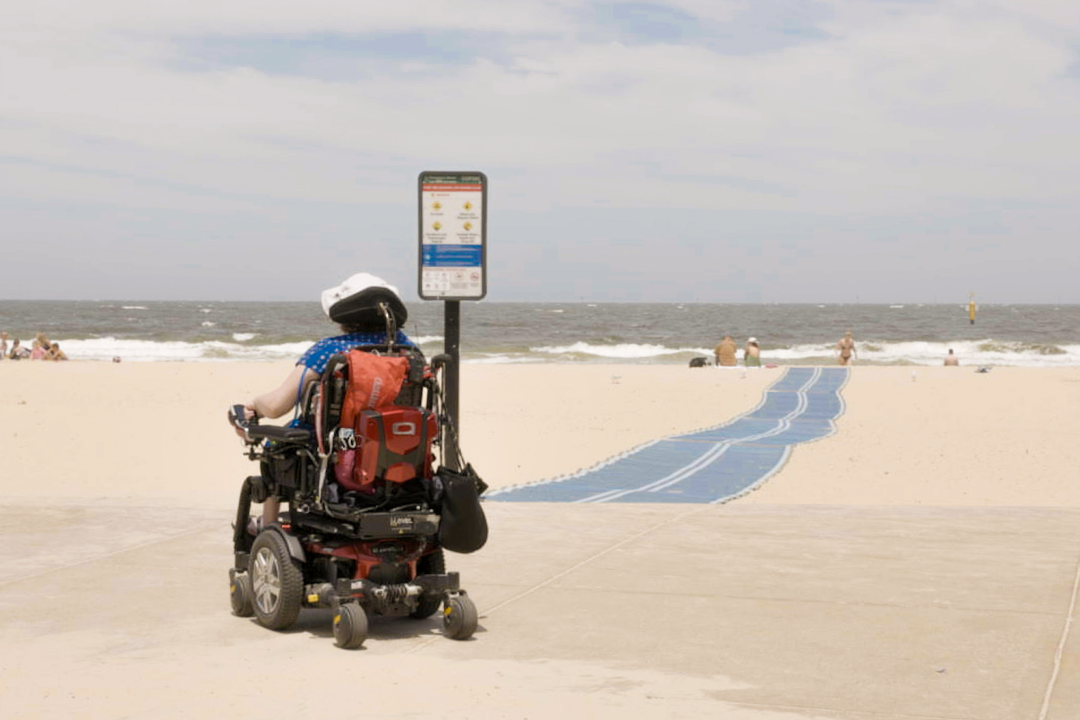 Person in a wheelchair on the beach